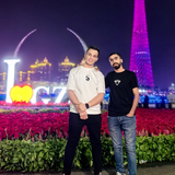 B. Lahcen, founder of Opteno, standing outdoors at night beside a companion.